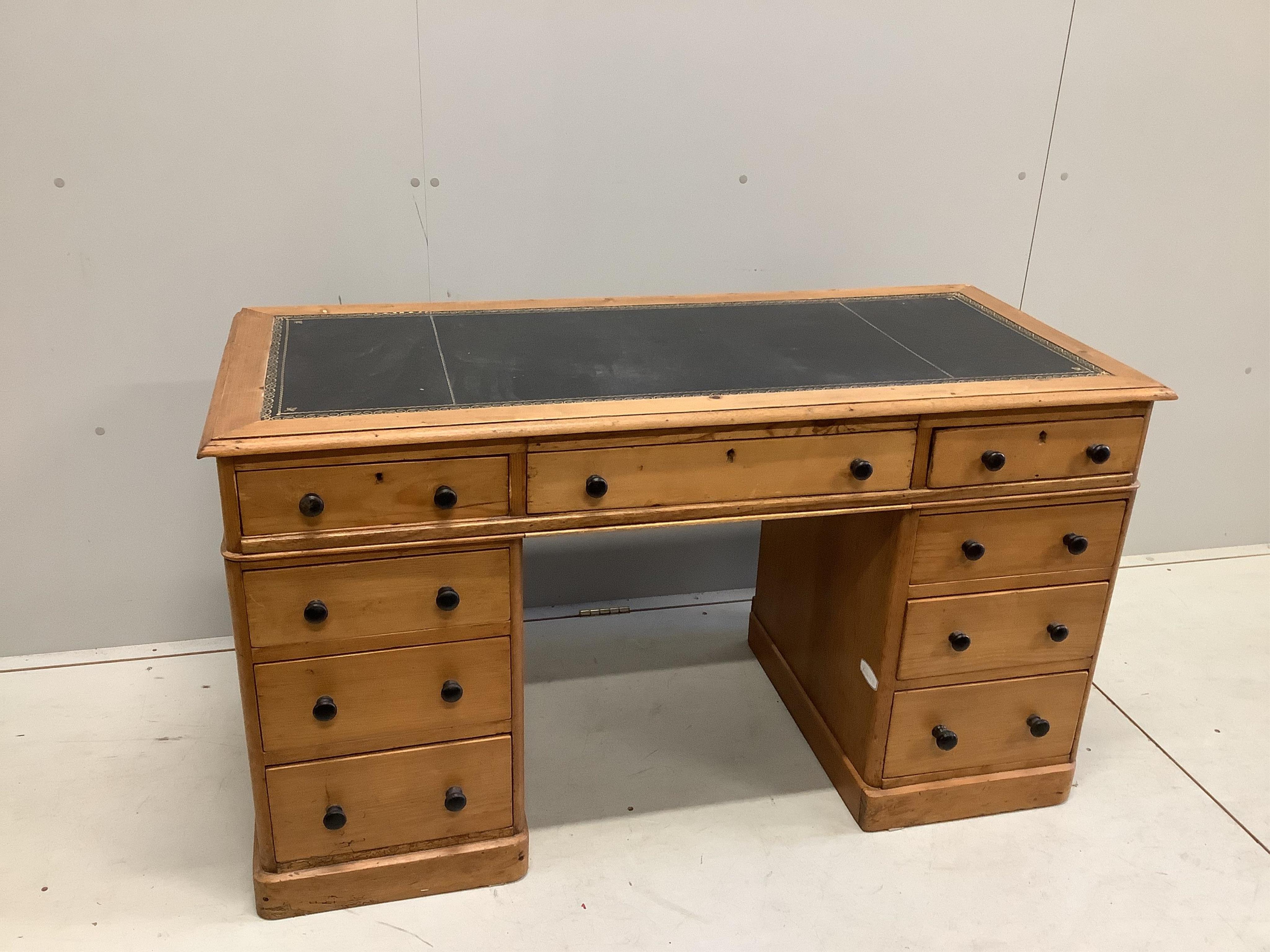 A late Victorian pine pedestal desk, width 131cm, depth 57cm, height 73cm. Condition - fair.